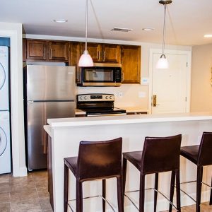 Model unit kitchen featuring modern finishes, and appliances.