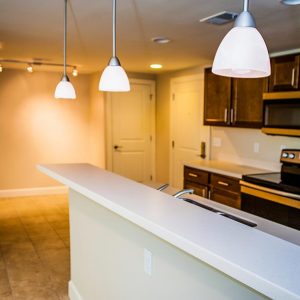 Model unit dining room and kitchen featuring modern finishes, and appliances